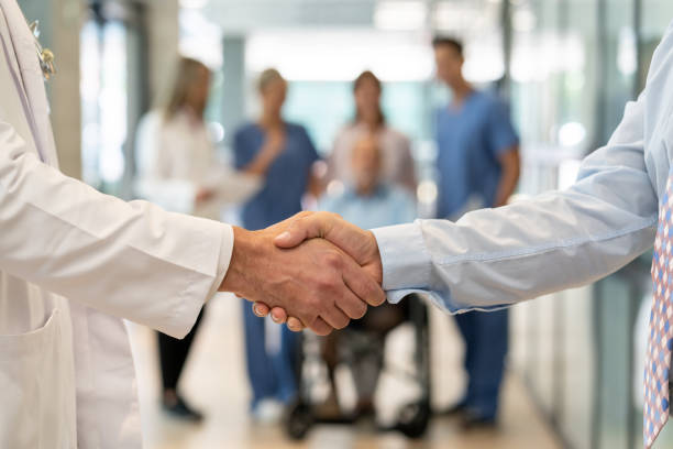 Healthcare leader reviewing candidates with a recruitment specialist